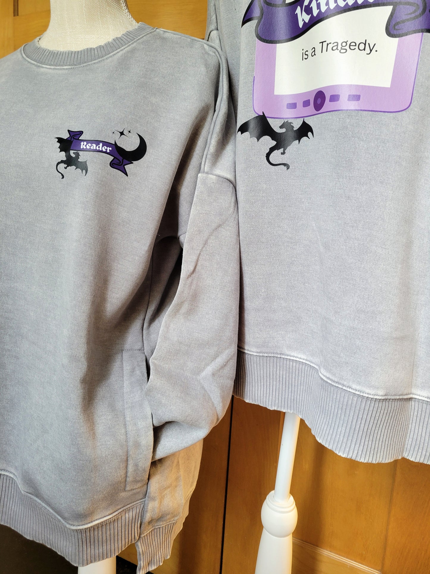 A Reader & Their Kindle Crewneck